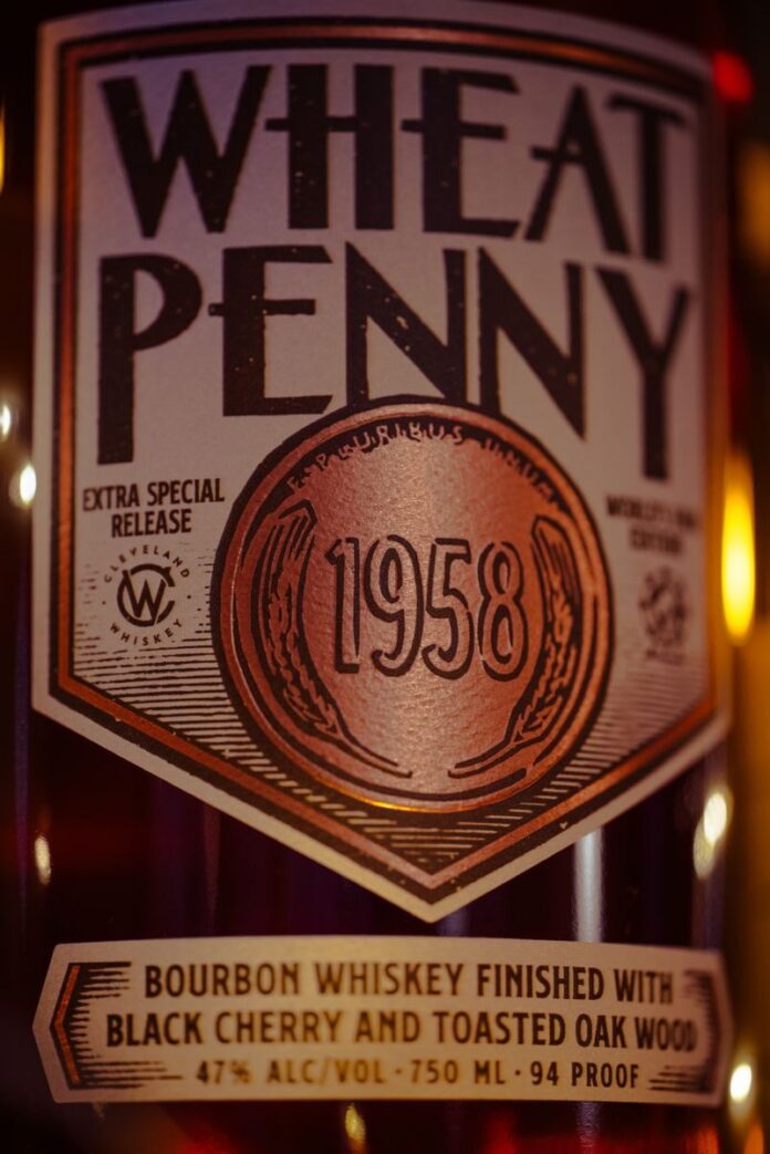 Photo by Chris F A detailed shot of a Wheat Penny 1958 bourbon whiskey bottle with rich lighting.