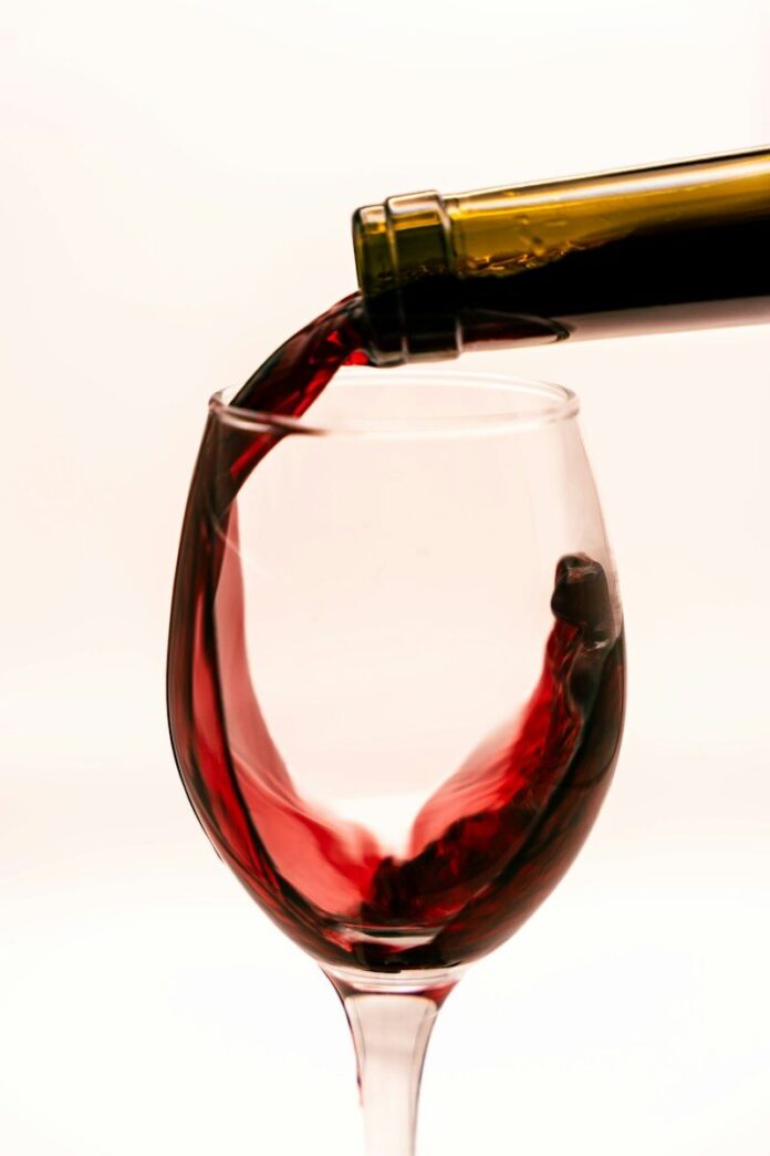 Red wine being poured into a glass